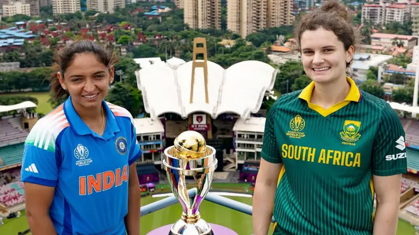 India captain Harmanpreet Kaur and South Africa captain Laura Wolvaardt pose with the ICC Women’s World Cup 2025 trophy ahead of the final. - ICC